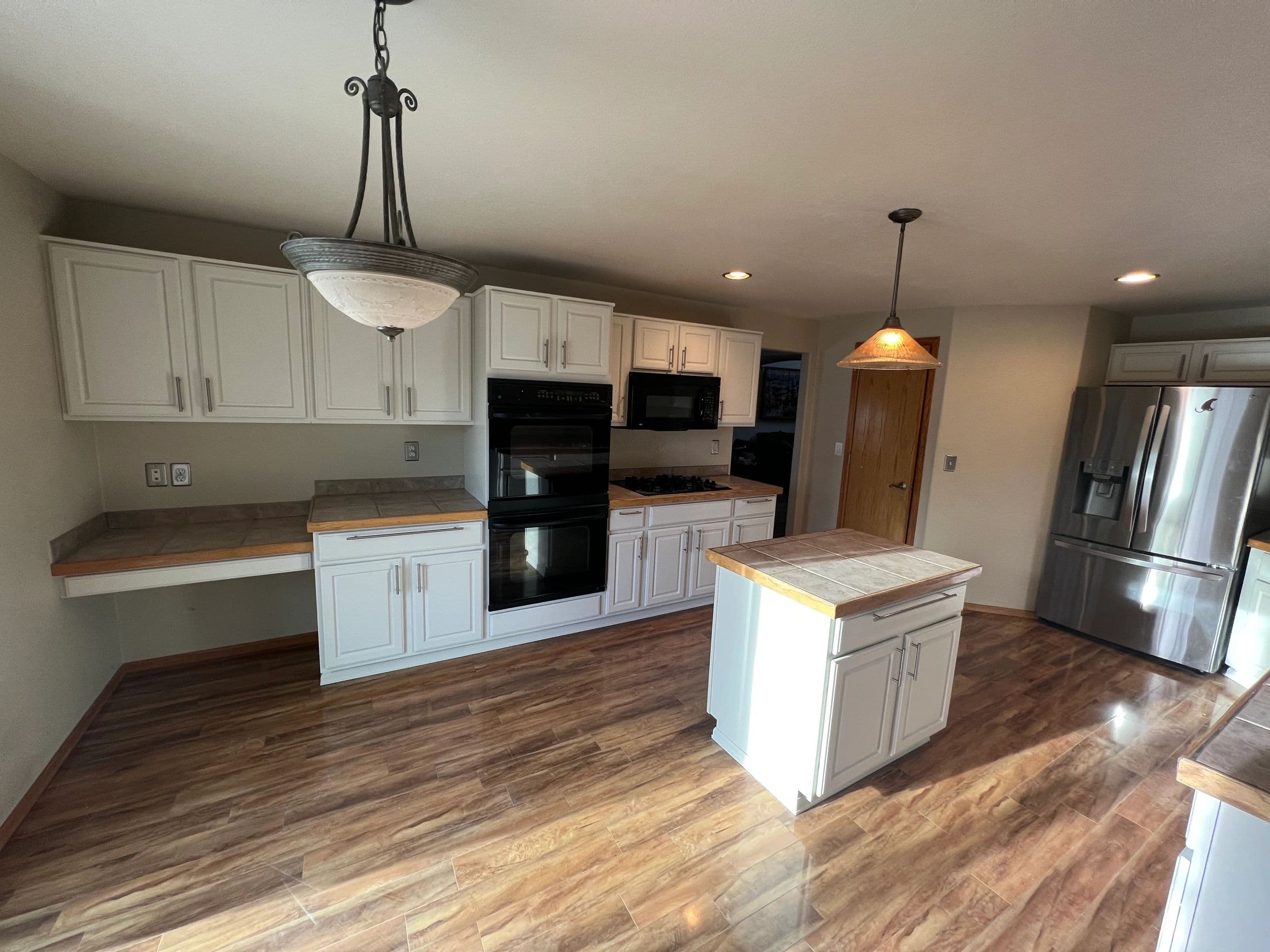White painted raised-panel kitchen cabinets